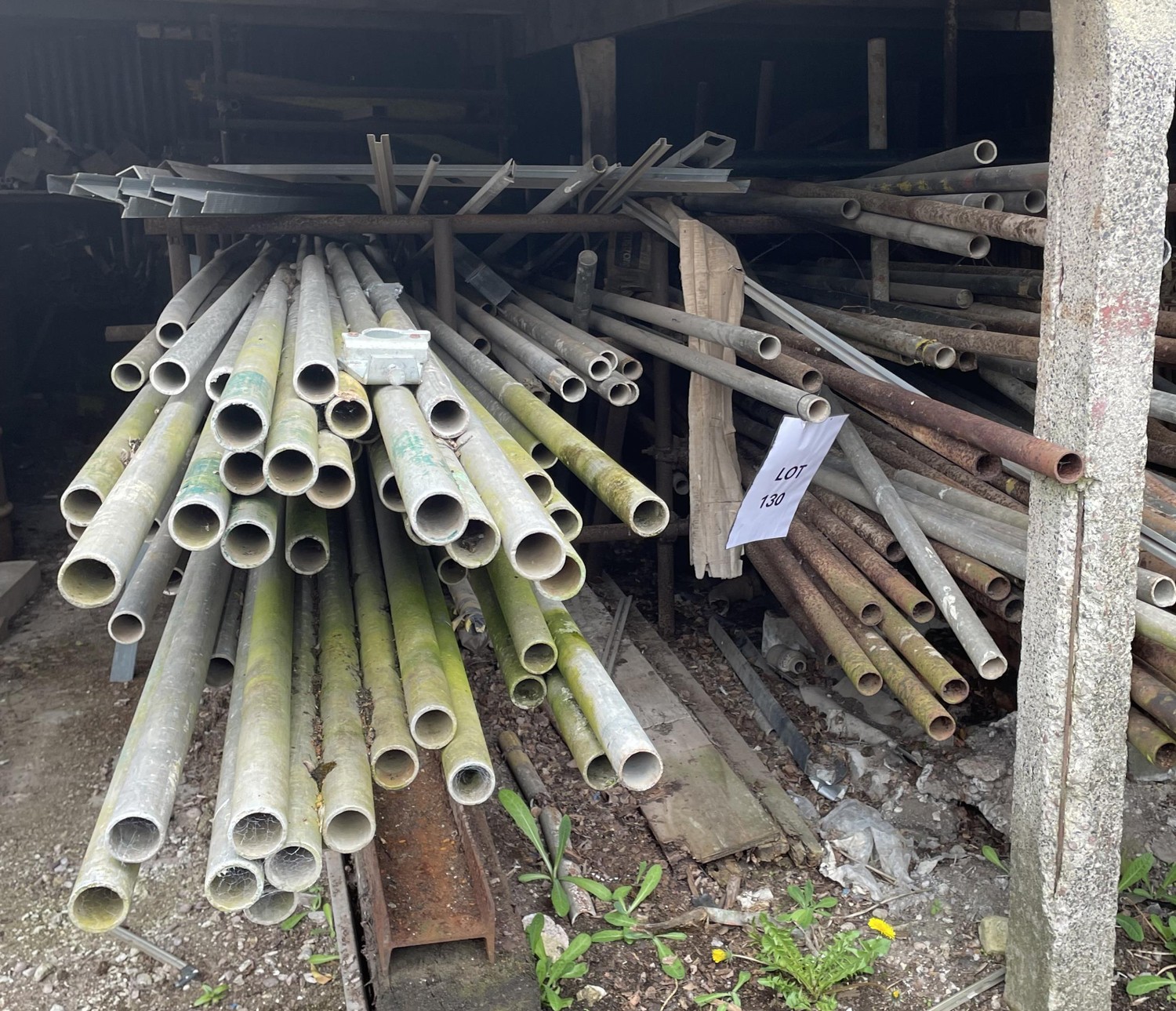 Large collection of aluminium and other scaffolding tubes and fittings