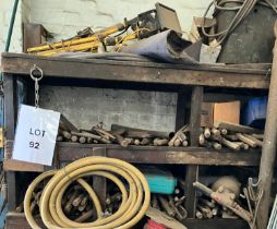 5 vintage jack hammers and chisels on 3 shelves