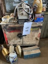 Wooden cupboard and contents to include Rockworth mig welder, tool box and various oils.