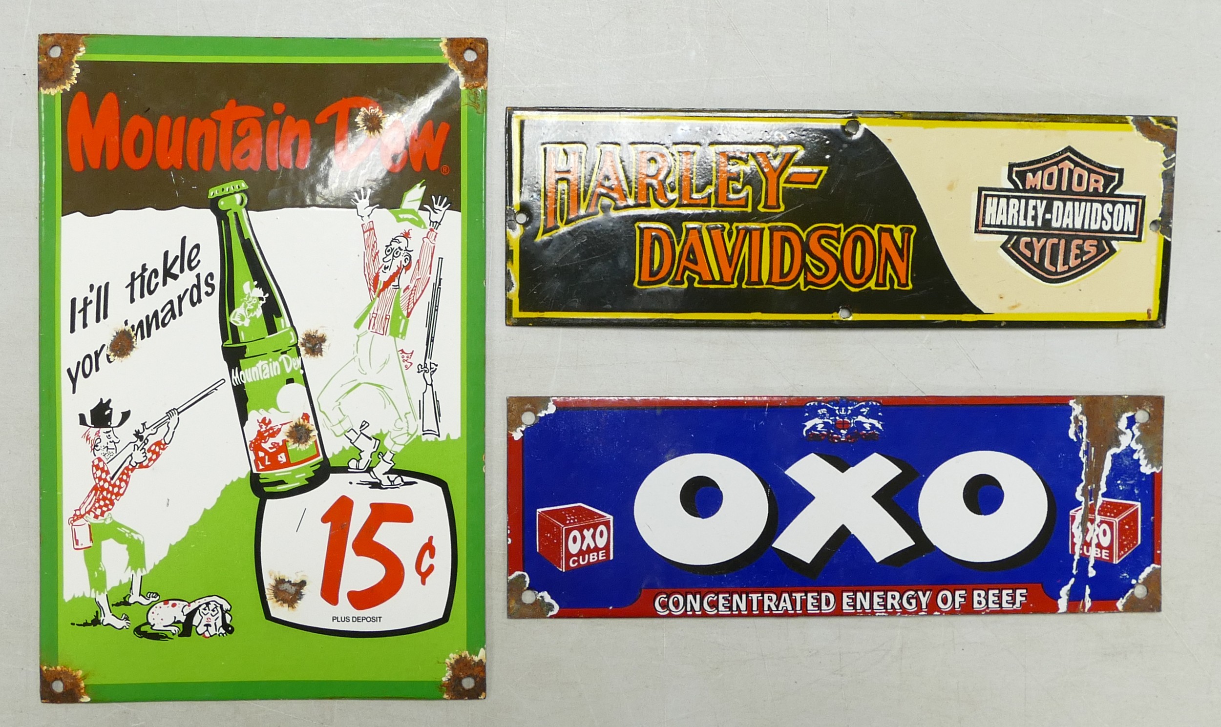 Three Enamel Advertising signs to include Mountain Dew, Oxo and Harley-Davidson. Size of largest,