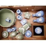 A collection of Wedgwood jasperware items to include footed fruit bowl, framed roundel, clock, vases