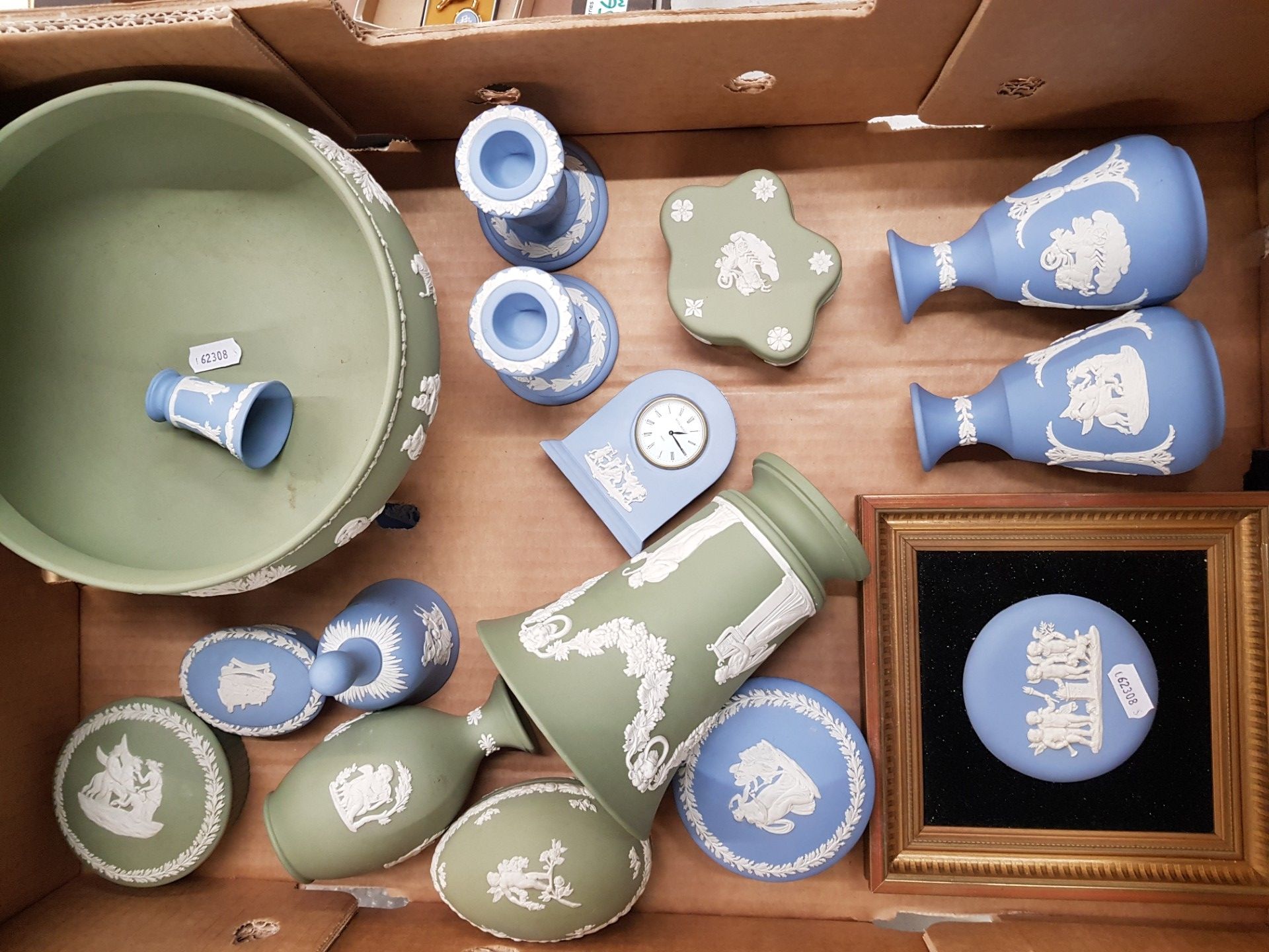 A collection of Wedgwood jasperware items to include footed fruit bowl, framed roundel, clock, vases