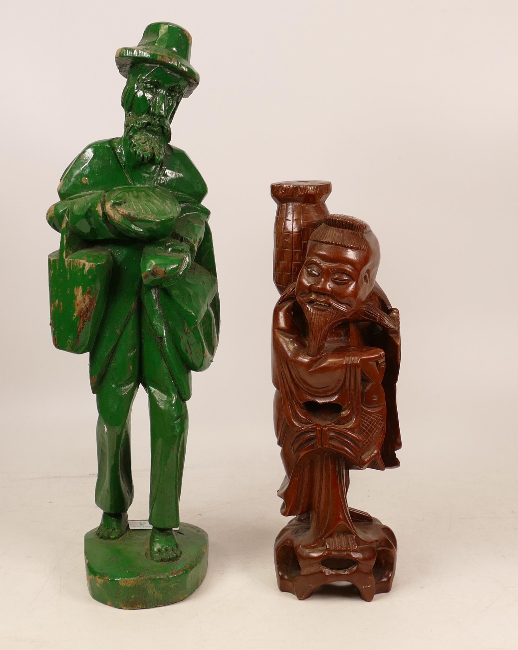 Carved Wooden Figure of a Vagabond painted in Green together with Hardwood Figure of a Eastern