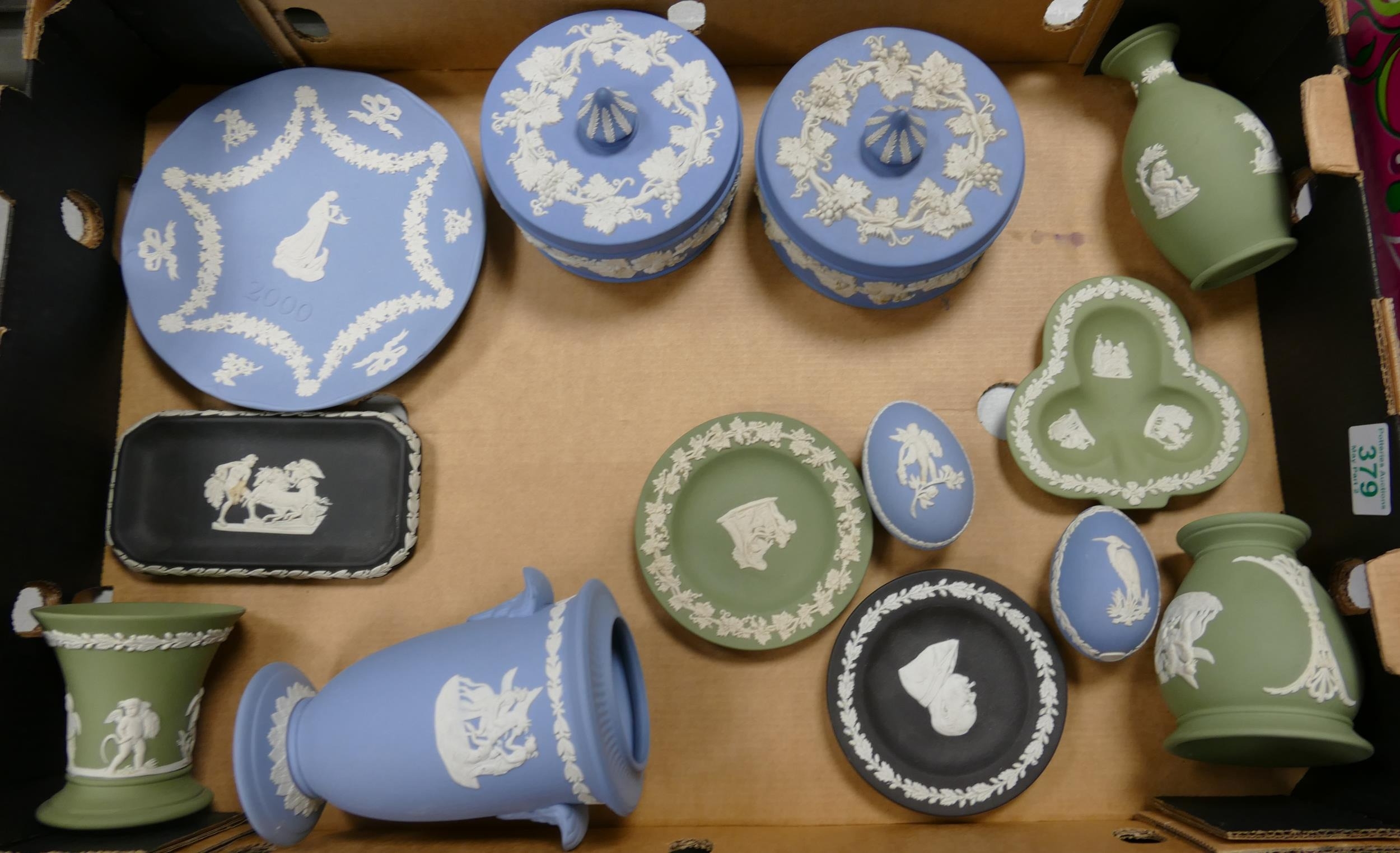 A collection of Wedgwood Jasperware to include black basalt pin dishes, green vases, blue lidded
