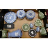 A collection of Wedgwood Jasperware to include black basalt pin dishes, green vases, blue lidded