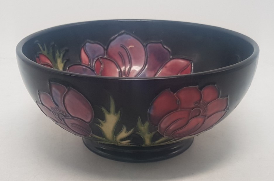 Moorcroft Anemone pattern on cobalt blue ground footed bowl, with internal and external