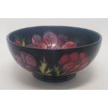 Moorcroft Anemone pattern on cobalt blue ground footed bowl, with internal and external