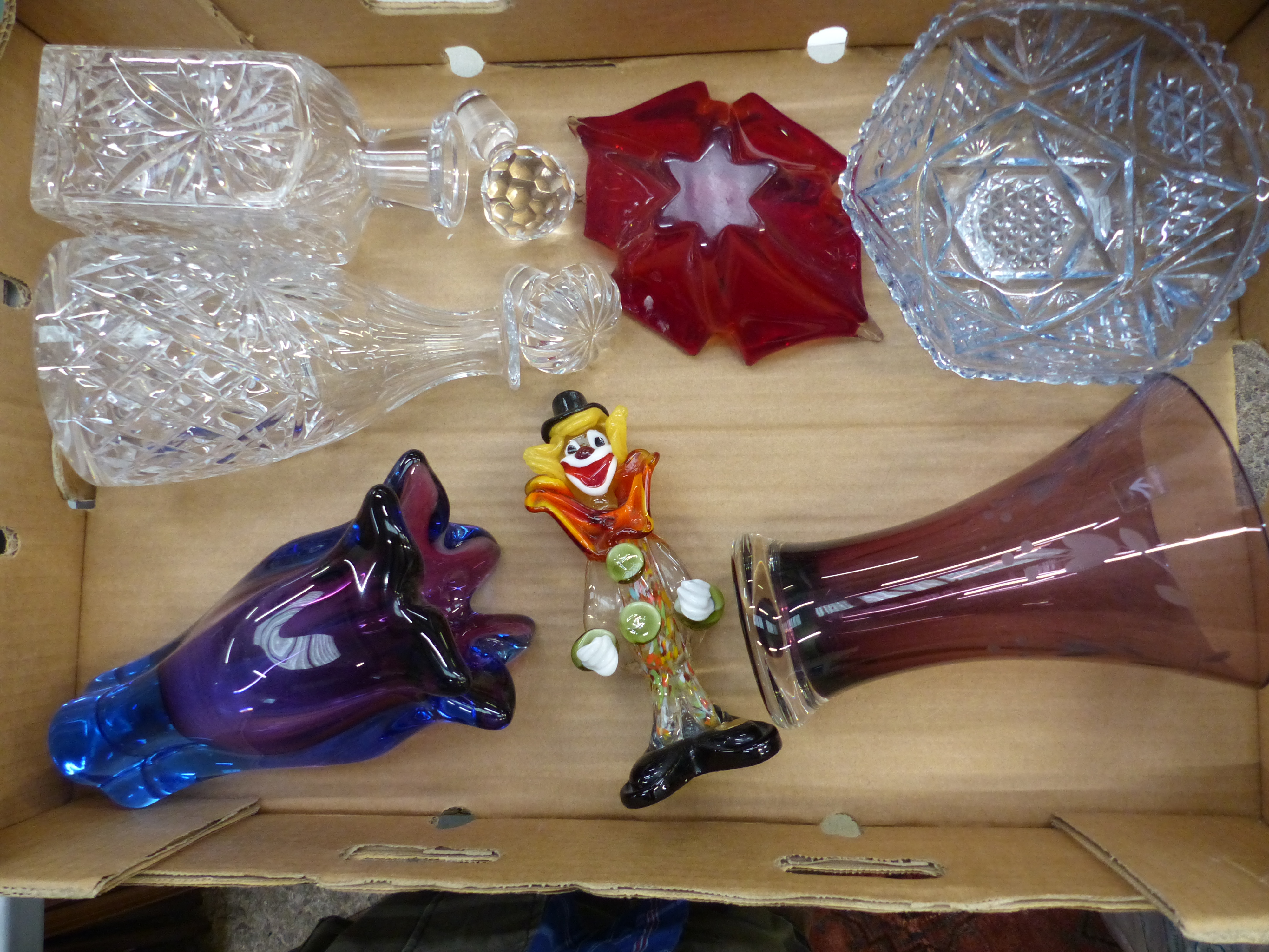 A collection of glass and crystal items to include two crystal decanters, art glass vase,