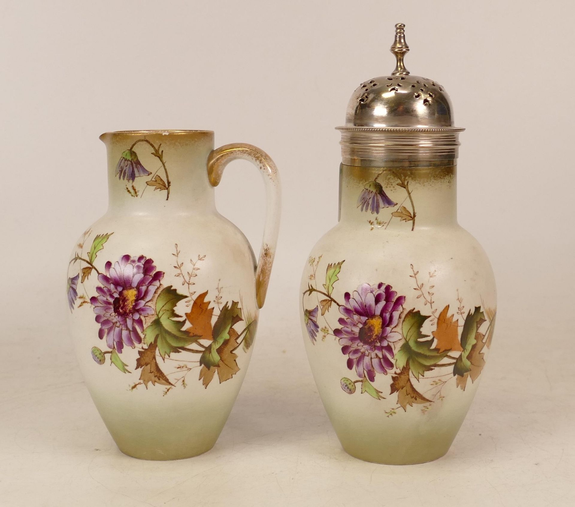 Carlton Ware Chrysanthemum patterned milk jug and sugar sifter. Height 17cm(2)