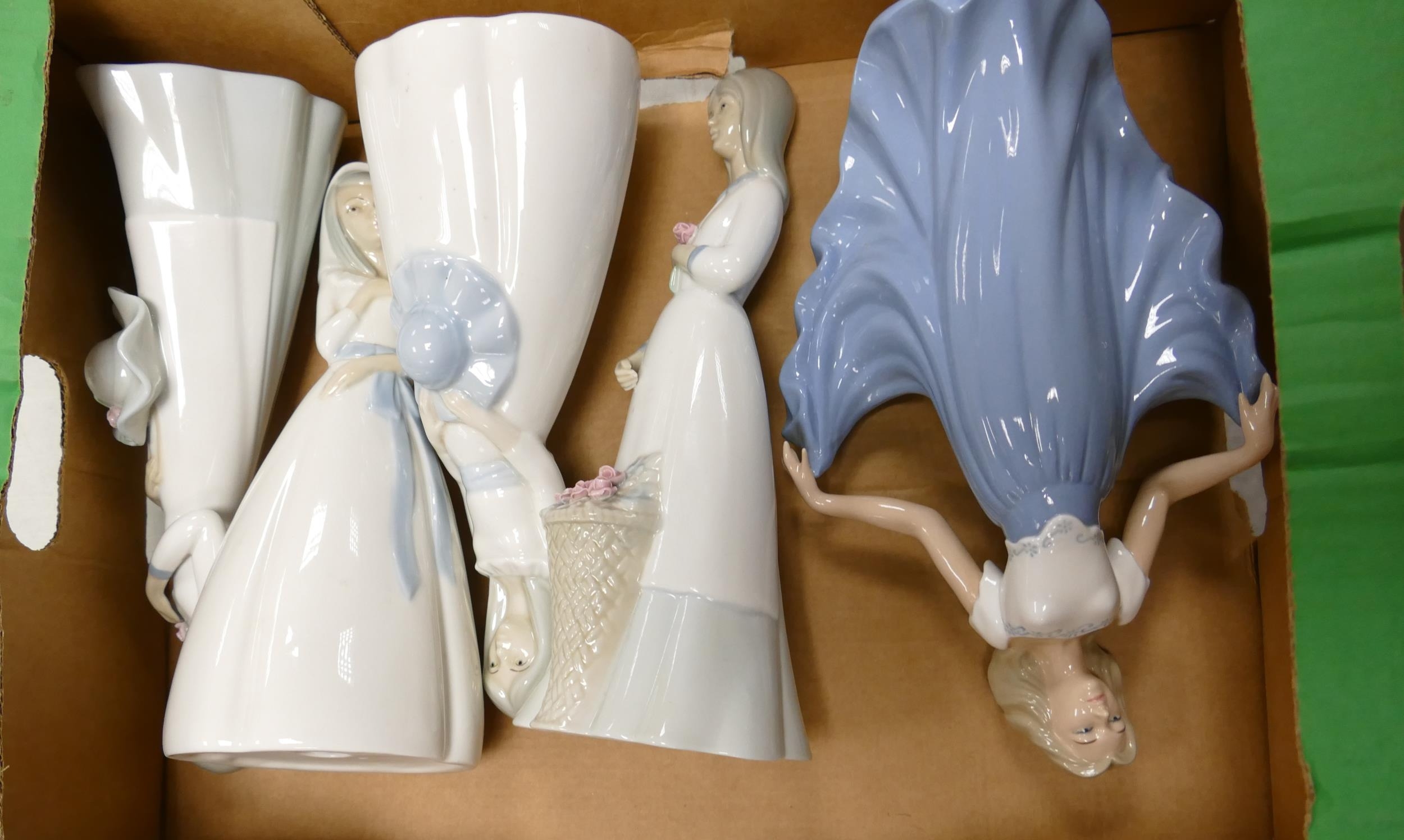 Four Porcelanas Miquel Requena S.A figures including girl holding flowers, girl in dress, girl