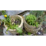A collection of 5 different shaped outdoor garden stone planters