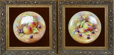 Two signed circular hand painted fruit plaques by F. Miate