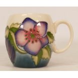 Moorcroft trial mug decorated in purple flowers 23/3/95