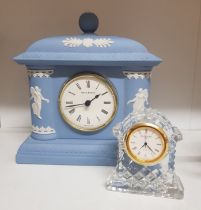 A Wedgwood Blue Jasperware Mantleclock together with a small Waterford Crystal example. (2)