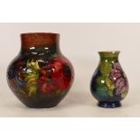 Moorcroft flambe Anemone patterned vase together with Anemone patterned vase on green ground, height