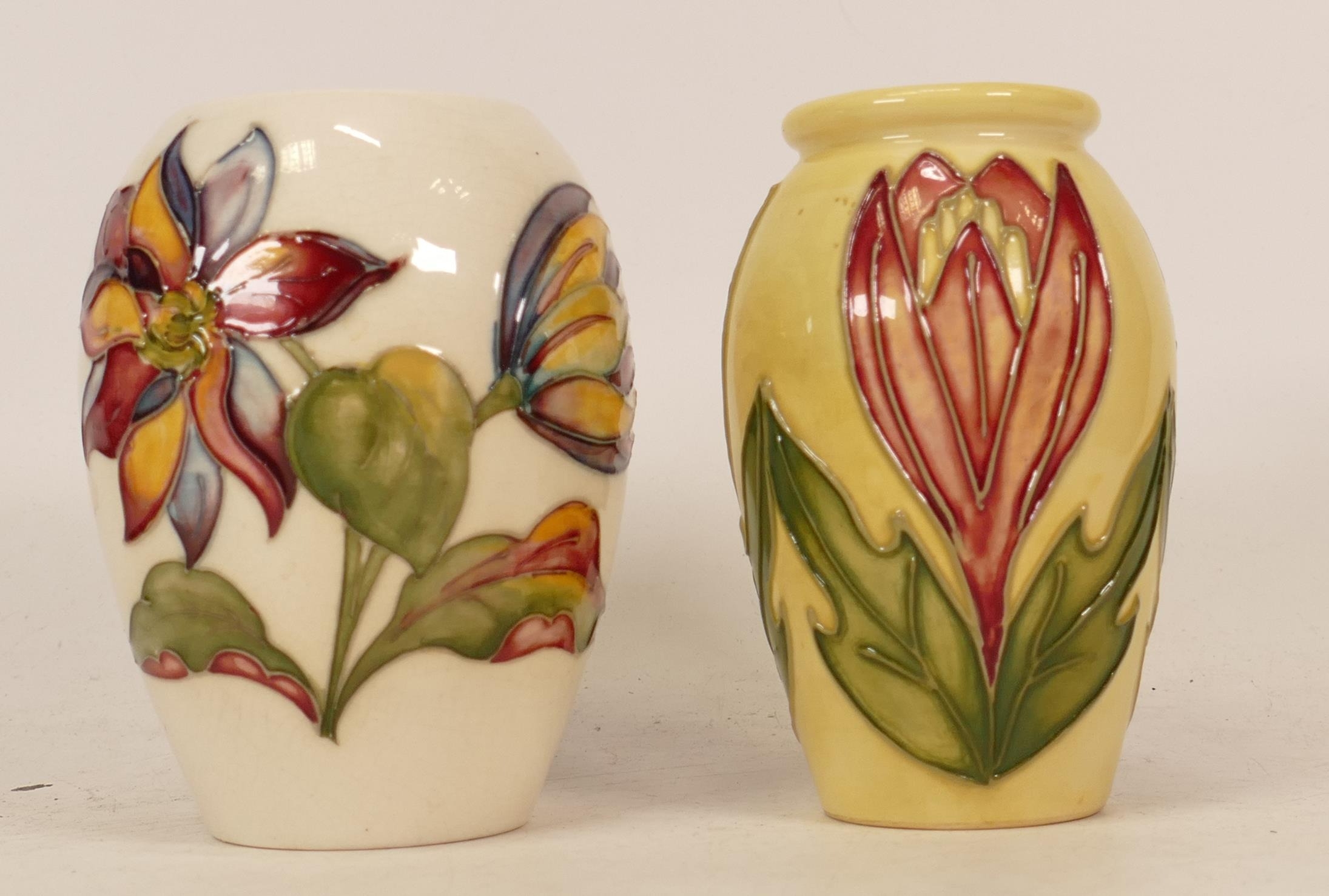 Moorcroft vase decorated in the Crocus together with Clematis decorated vase (Queen Mary sticker