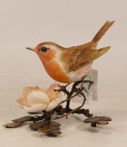 An Albany Fine China Co. Ceramic bird study incorporating metal. Modelled as a Robin with a