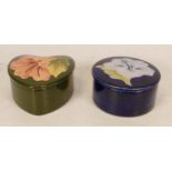 Moorcroft Hibiscus round lidded trinket box on blue ground together with Hibiscus heart shaped