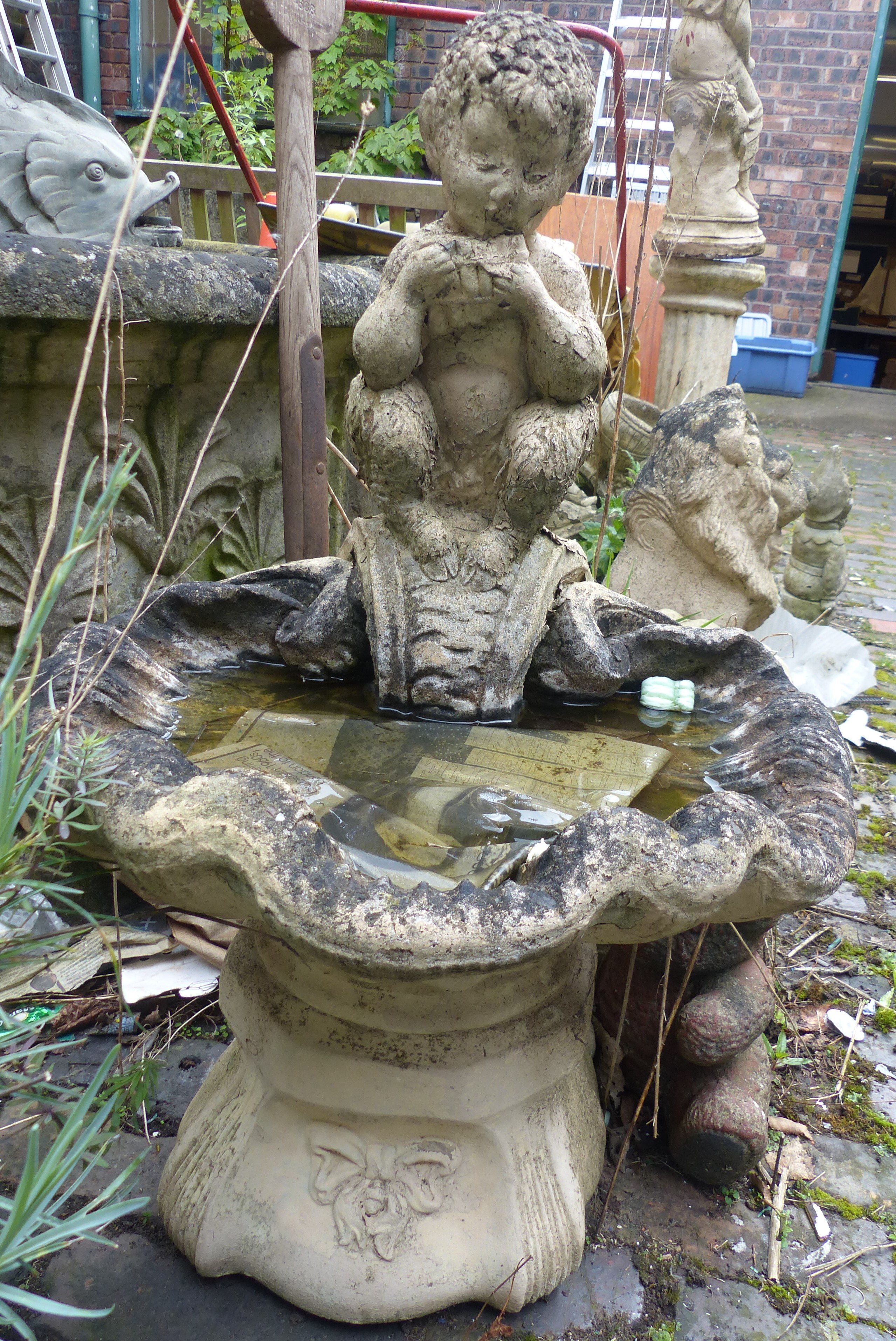 A simple post water feature with bowl garden ornament