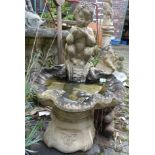 A simple post water feature with bowl garden ornament