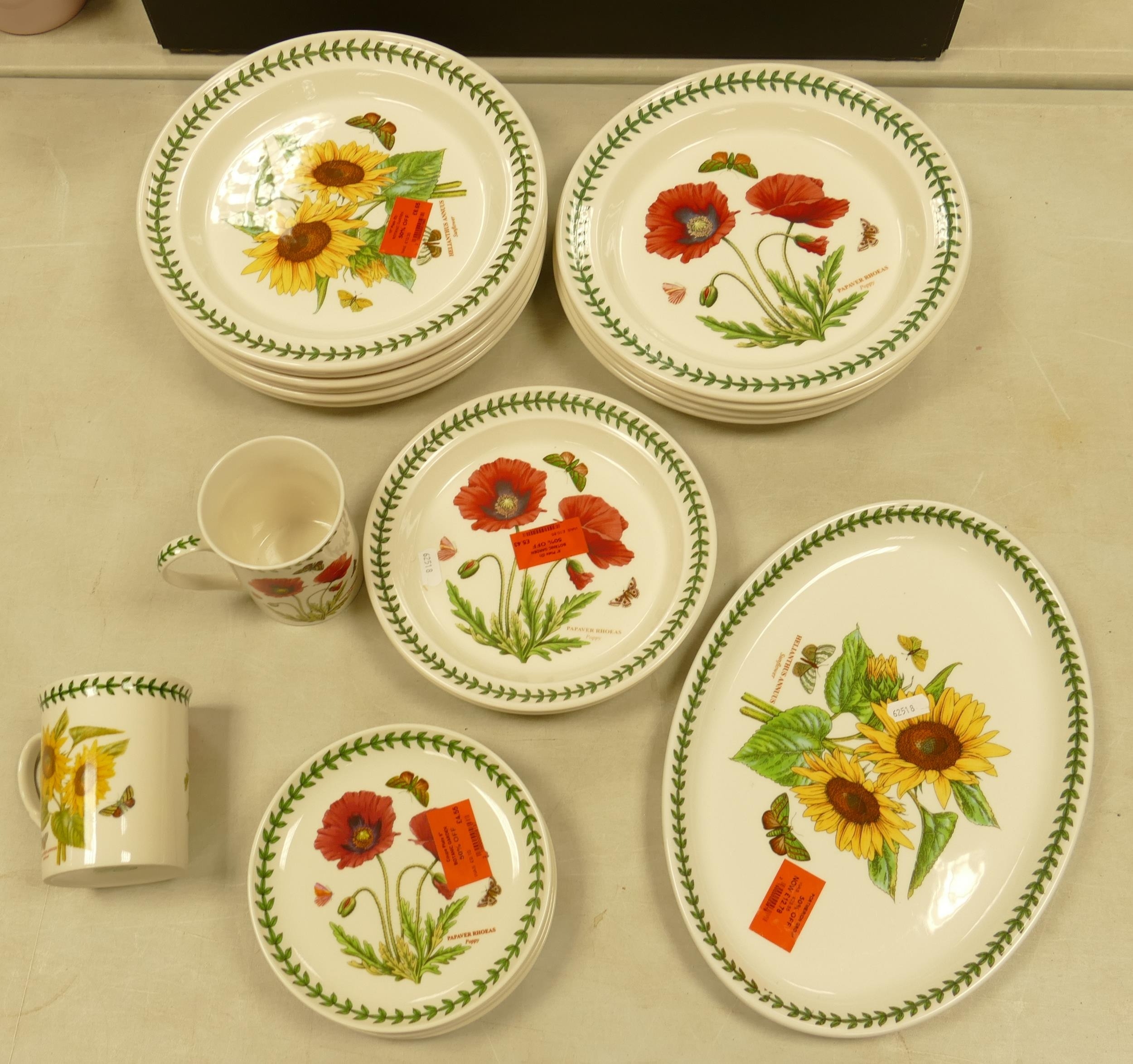 A collection of Portmeirion dinner ware in the poppy and sun flower pattern to include dinner plates