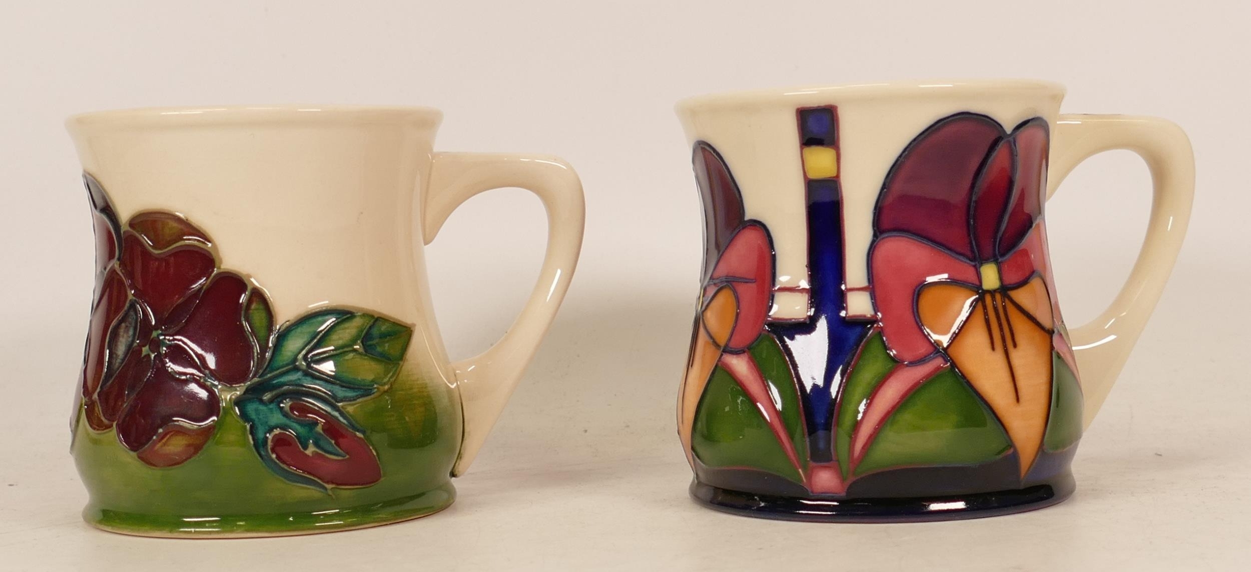 Two boxed Moorcroft floral decorated mugs