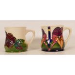 Two boxed Moorcroft floral decorated mugs