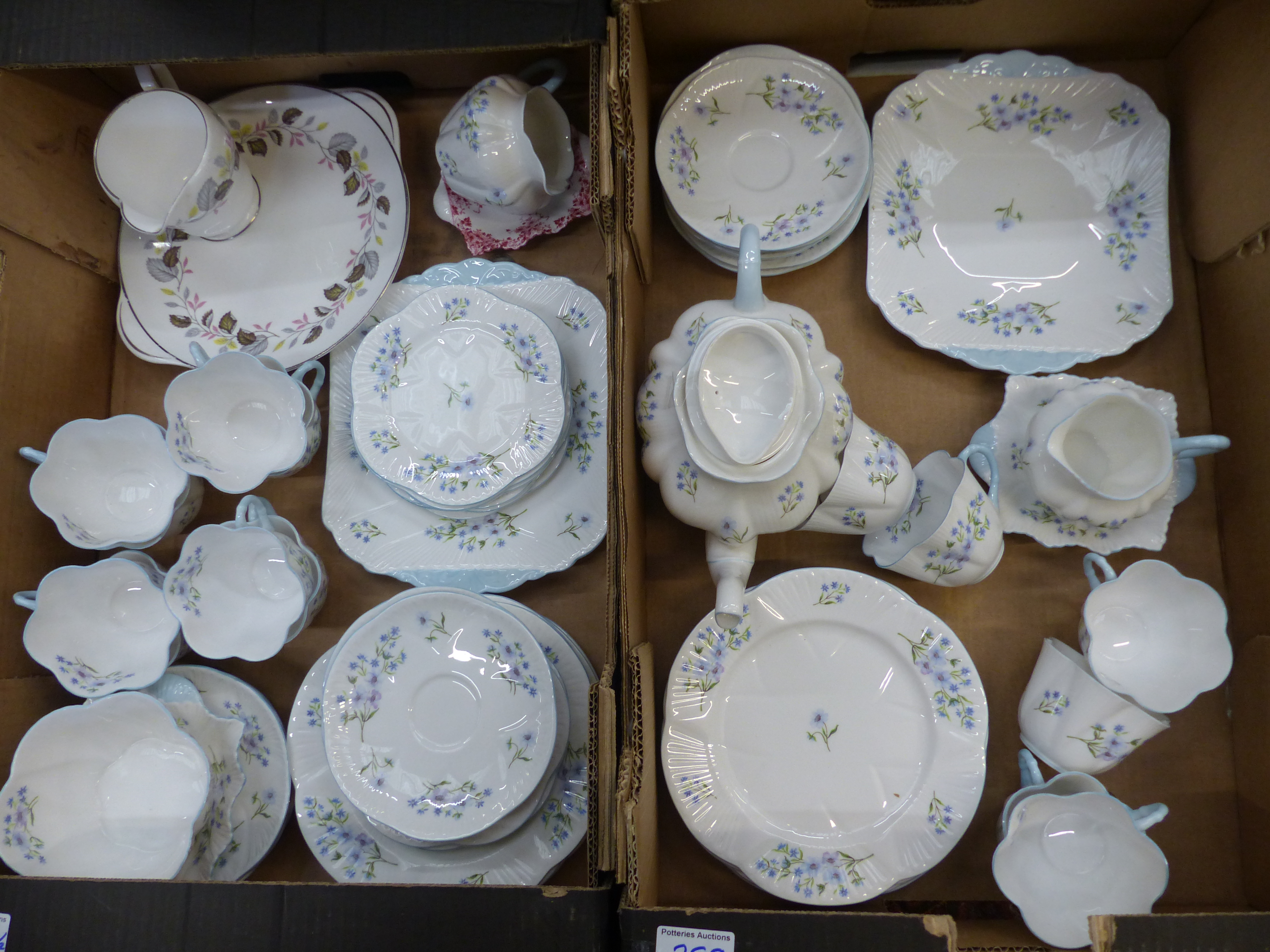 Extensive blue rock tea ware items consisting of Teapot, two cake plates, sugar bowl, 2 milk jugs,