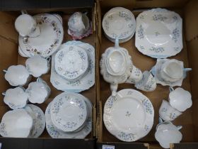 Extensive blue rock tea ware items consisting of Teapot, two cake plates, sugar bowl, 2 milk jugs,