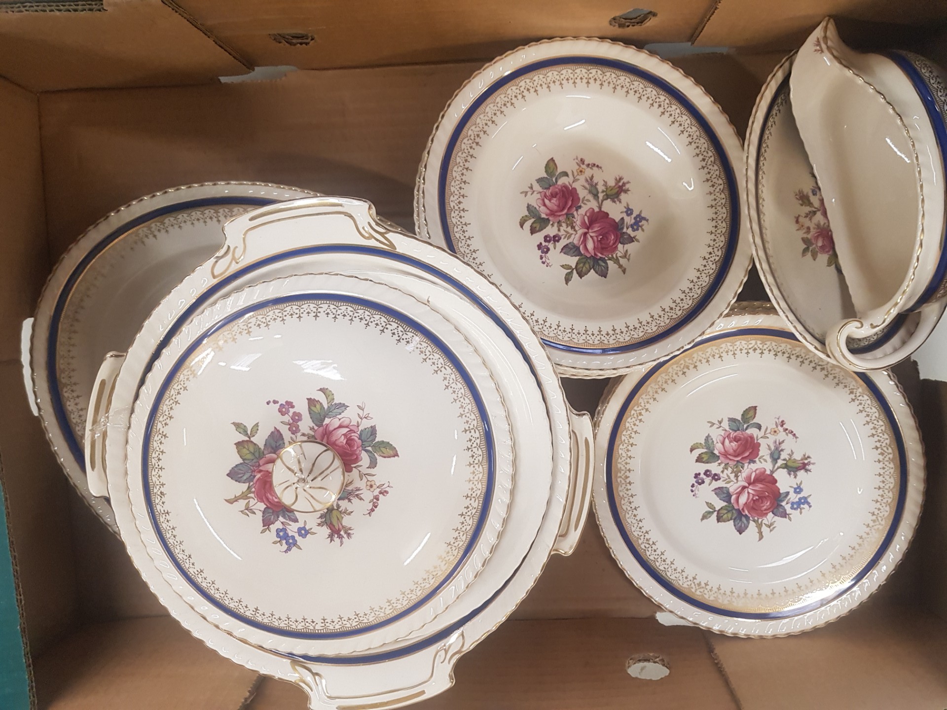 A collection of Johnson Bros. Old English pattern dinnerware to include lidded tureens, dinner