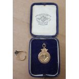 A 9ct gold cricket medal weighing 3.6g together with a broken 18ct gold ring 2.3g (2).