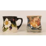 Moorcroft mug of the year 1991 and Moorcroft mug decorated with white flowers and berries, boxed (2)