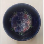 Moorcroft Anemone pattern on cobalt blue ground small footed bowl, 11cm in diameter.