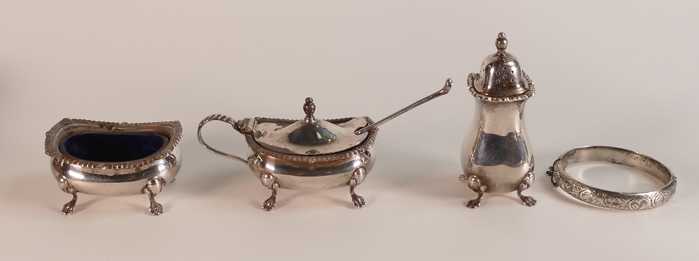 A collection of hallmarked silver cruet items and a bangle, 216.2g.
