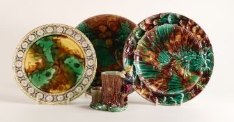 Three 19th century Wedgwood Majolica plates together with an unmarked Majolica spill vase in the