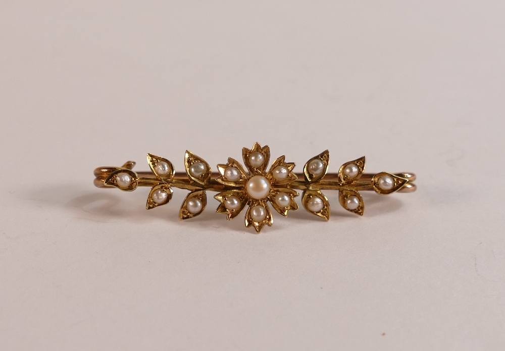 Antique yellow metal brooch, floral design set with seed pearls, electronically tested to be 15ct