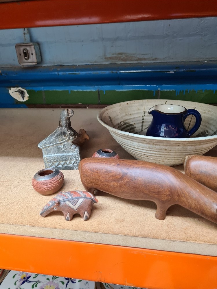 A sundry lot to include jugs and two 1970s teak Rhinos