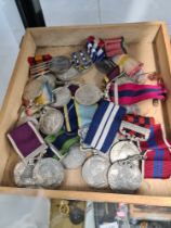 A small tray of reproduction Military medals