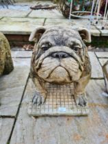 A reconstituted figure of seated bulldog on oblong base by Sanctuary Stone