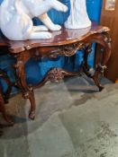 A reproduction mahogany console table having cabriolet legs