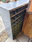 A grey painted steel pigeon hole cabinet