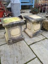 A pair of reconstituted square garden pedestals