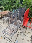 A set of 4 metal garden chairs having lattice design
