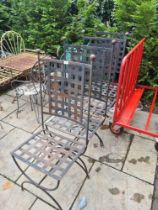 A set of 4 metal garden chairs having lattice design