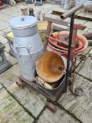 A milk churn, a galvanised bucket, a cast tractor seat and sundry