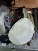 A selection of vintage hats some being Naval and motorcycle and jackets and books of The History of