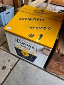 A Corona lager cool box, an AA perspex hotel sign and a wooden crate