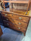 An antique mahogany chest having 3 long drawers on splay feet