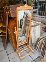 A reproduction pine Cheval mirror