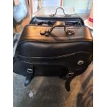 A pair of black leather motorcycle panniers